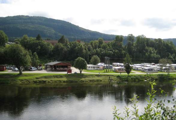 Surnadal borders on the districts of Halsa, Rindal and the county of Sr-Trndelag in the Trollheimen moutain range,  Communication: Ferry between Kvanne - Rykkjern and bus service to Kristiansund, Halsa, 200. Administrative centre: Skei, with the council offices, cultural centre, hotel, shopping centre, caf233 