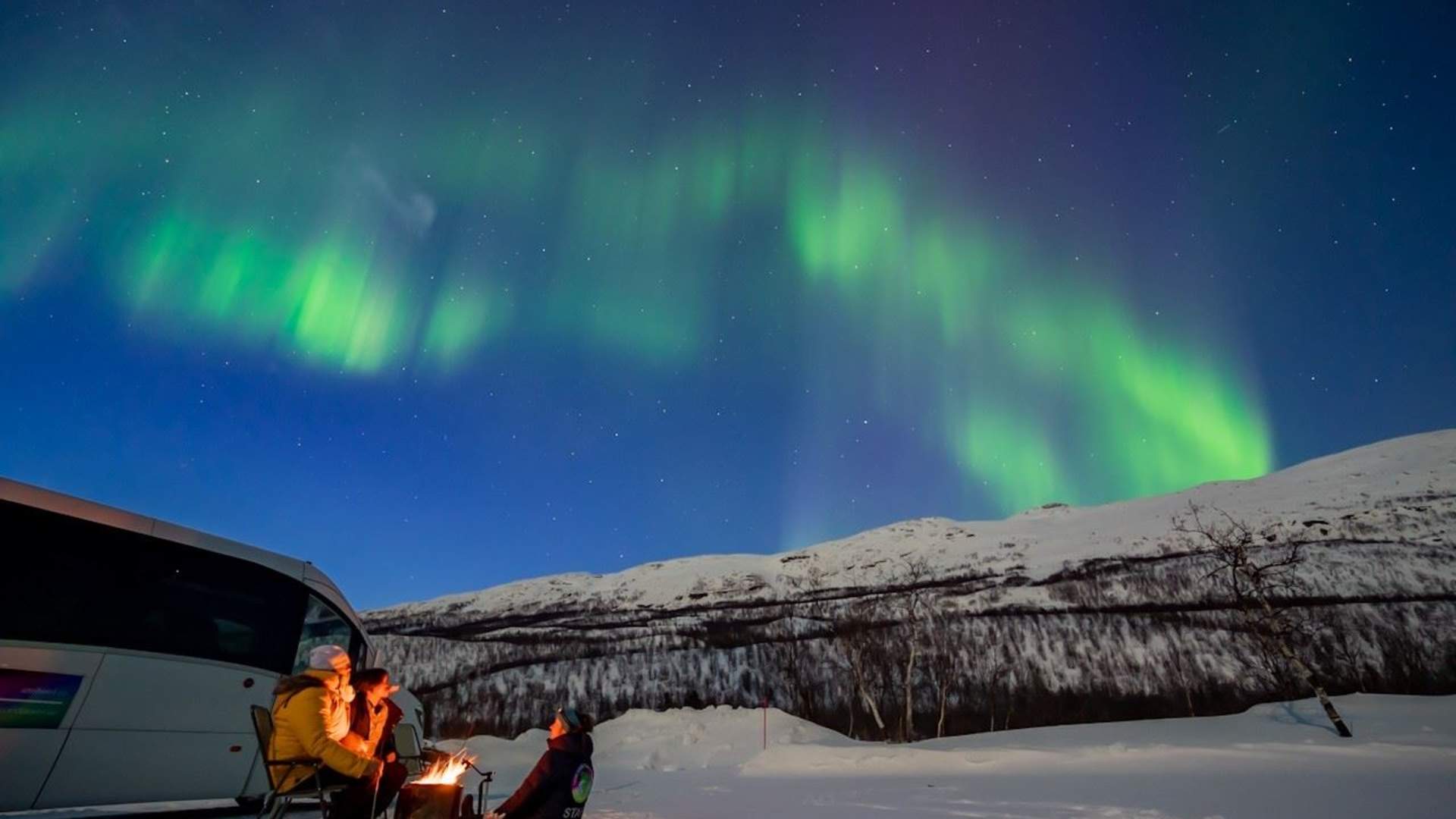 Northern lights chase by minibus