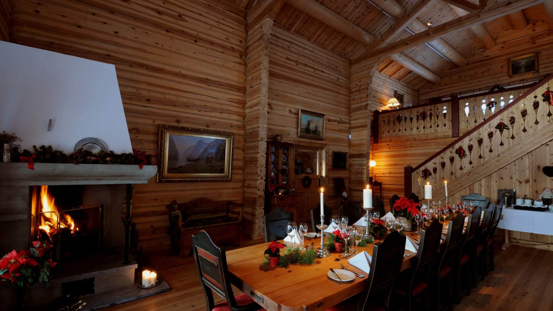 Dining room and fireplace at Storfjord Hotel