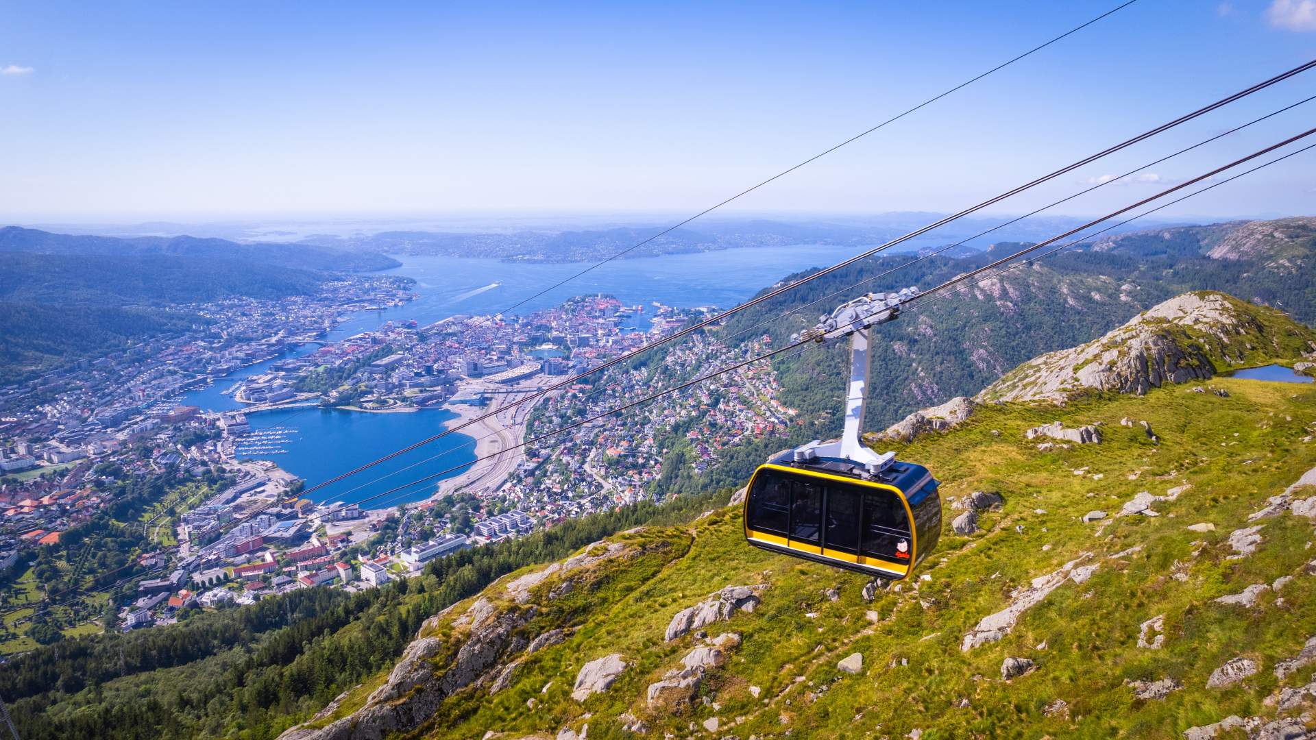 Yellow gondola with view to the city center