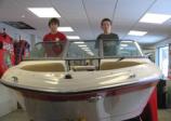 Jacob (left) and Adam Cooper, seen here at Cooper’s Marina in Baldwinsville, earned their Young Boater Safety Certificates at the 2010 Central New York Boat Show. Photo: Cooper’s Marina