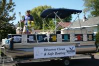 New York Sea Grant Coastal Recreation and Tourism Specialist Dave White shows required and recommended items for safe and legal boating in New York waters aboard 2010 Discover Clean, Green and Safe Boating educational vessel. The vessel is visiting events and sites along New York’s freshwater shoreline this summer, including the July 23-24 Skaneateles Boat Show.