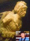 James H. Fischer in 19th century sailor’s dress is seen below the bust of U.S. merchant ship Diana purchased in Oswego and converted in Sacketts Harbour in 1812 as the US naval warship Hamilton.