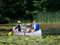 FAMILY OF PADDLERS - The Jan van der Heide family helped to pull water chestnuts from the lower Salmon River at Port Ontario last summer. Oswego County River Guides, New York Sea Grant, and other volunteers will hold a water chestnut pull Saturday, July 14. Volunteers will meet at the Pine Grove Boat Launch. (Photo by Janet Clerkin, Oswego County Tourism Office.)