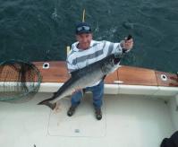 A WHALE OF A FISH! – Brian Franklin of Newville, PA, shows off his 26 ½ pound salmon caught on Lake Ontario with Captain Greg Gehrig of Top Gun Charters in Oswego. This year marks the best fishing many anglers have seen in more than two decades, in part due to the recent mild winter in Oswego County. Photo courtesy of Capt. Gehrig.