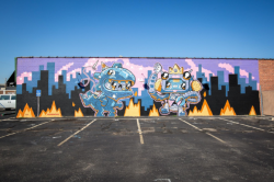 Robot dinosaur mural on the side of The Workroom in Wichita KS