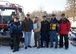 SNOWMOBILE SAFETY WEEK – County Legislature Chairman Barry Leemann presents a proclamation for Snowmobile Safety Week to members of the Oswego County Snowmobile Association. From left are Bob and Carolyn Prockup, Kasoag Trailblazers; Legislature Chairman Leemann; Ed Montieth, president of the Oswego County Snowmobile Association; County Legislator Milferd Potter; Jeff Hopkinson, president of the Kasoag Trailblazers, and Peter Hopkinson, Kasoag Trailblazers.
