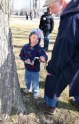 Museum Interpreter Wayne Coursen shows a young visitor how to tap a maple tree during last year’s Sugaring Off Sundays event at The Farmers’ Museum in Cooperstown, New York.