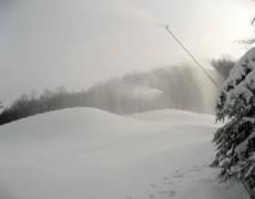 Snowmaking on School Haus Beginner’s Area. These mounds will be groomed out to create a smooth covering of snow over this 900 foot slope in preparation for Thursday’s opening.