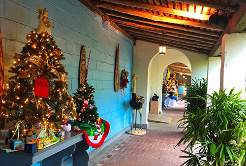 The Bonnet House Museum & Gardens in Fort Lauderdale is an architectural delight and features framed art, lush tropical landscaping, fountains. It is adorned with designer-decorated trees during the holiday season.