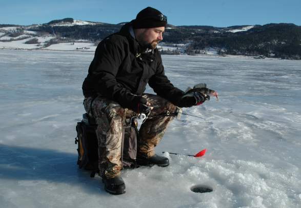 Ice fishing near Lyngstrand Camping