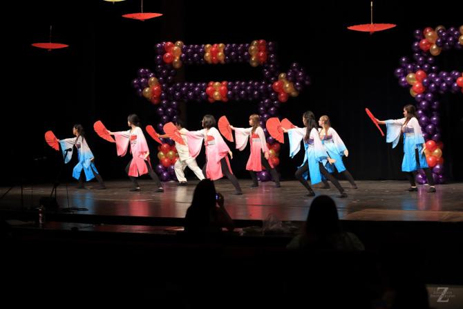 Participants at Wichita Asian Festival dance in Wichita KS