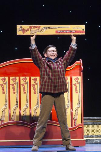 Boy holding Red Ryder BB Gun in the Christmas Story, Broadway Grand Rapids.