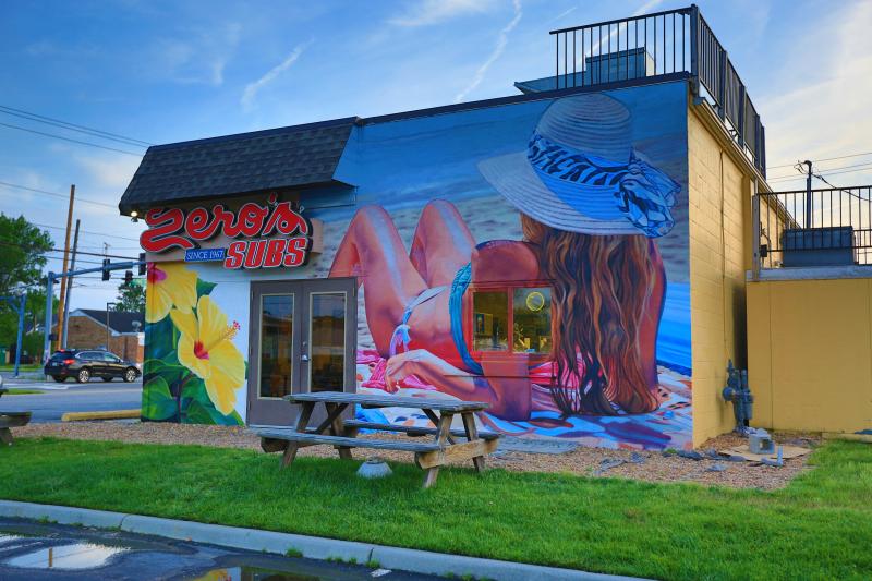 Where To Find The Most Colorful Walls In Virginia Beach Artist Eric Lindberg Of Talent Muralsvirginia Beach Vawomen Reclining On The Property