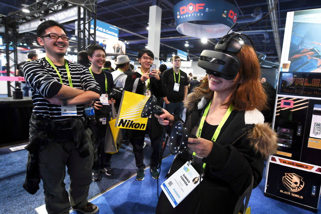 Woman using VR headset at CES