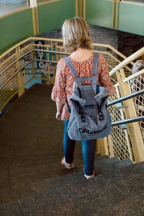 Girl wearing a Grand Rapids Children's Museum Sensory Friendly Tool Kit