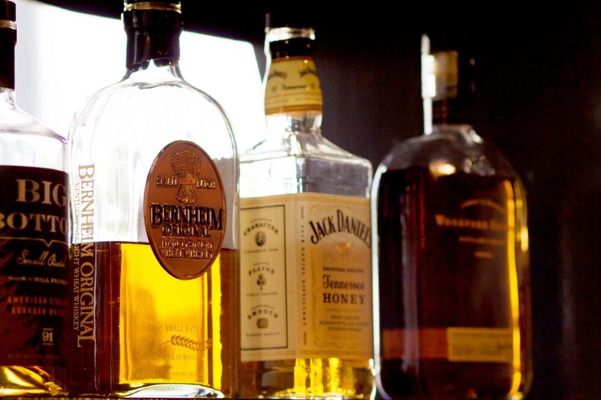 Bourbon and whiskey on display at The Refinery in downtown Lafayette
