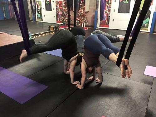 Women take a G-Force Fitness yoga class