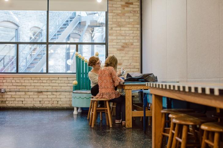Woman and girl exploring the Grand Rapids Children's Museum Sensory Friendly Tool Kit