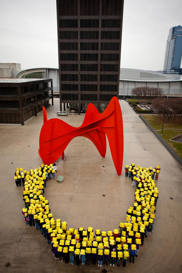 People forming LaughFest logo at Calder Plaza in Grand Rapids for LaughFest 2011
