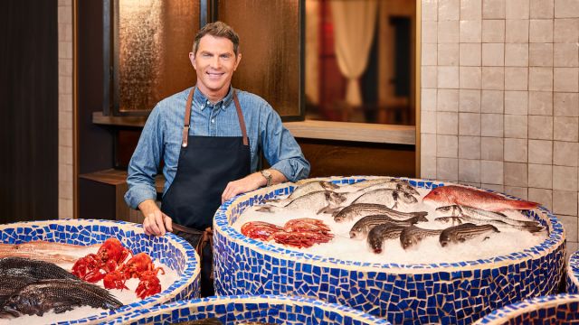 World famous chef Bobby Flay standing proudly in front of his fresh seafood at Amalfi in Las Vegas.