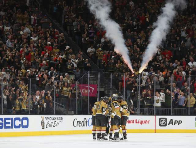 The Vegas Golden Knights huddling together.