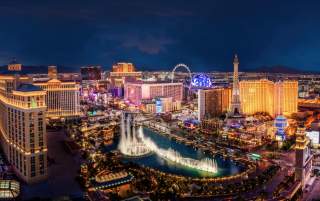 Aerial view of the Las Vegas Strip at night with the Fountains of Bellagio.