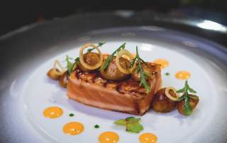 Joël Robuchon glazed salmon dish with mushrooms and citrus purée.