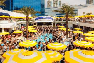 Stage, umbrellas, and crowd at LIV Beach Club