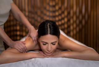 woman getting massage at the Palms Spa