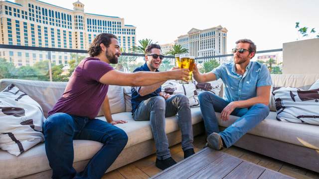 Three guys enjoying a beer at Beer Park at Paris Las Vegas.