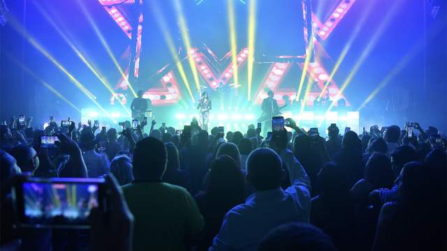 Matute band performs for the crowd with flashing lights