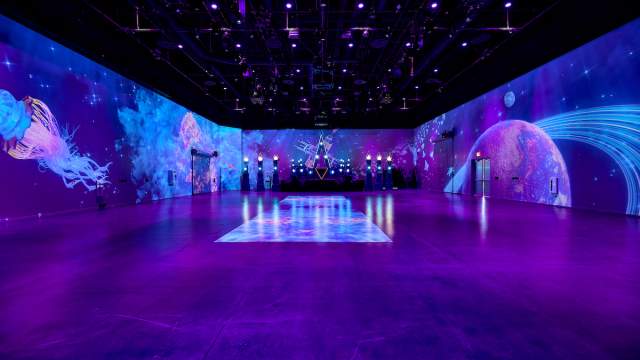 A stunning venue at AREA15 with wall projections.