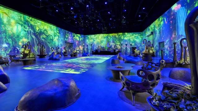 A stunning event venue at AREA15 with colorful wall projections.