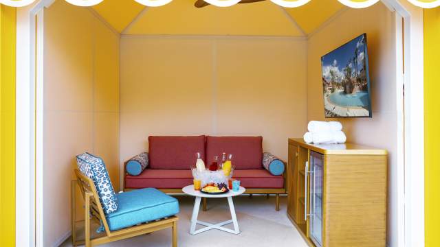 Spacious private pool cabana with amenities such as a TV and drinks at the Rio Pool.