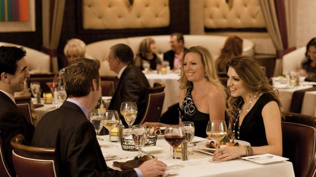 Two couples enjoying themselves at a luxurious dinner at Eureka Gregory's.