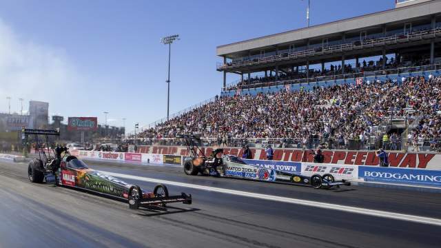 A race car zooming down the street at the Las Vegas Motor Speedway.