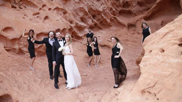 Bride, Groom and wedding party posing in Red Rock Canyon