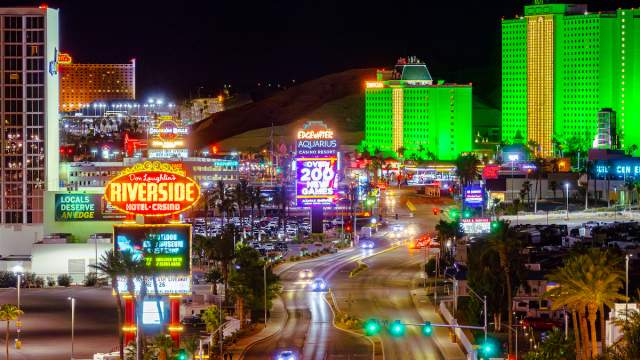 A view of the Laughlin Strip at night with signs lit up.