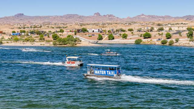 A water taxi on the Colorado River in Laughlin with the mountains in the background.