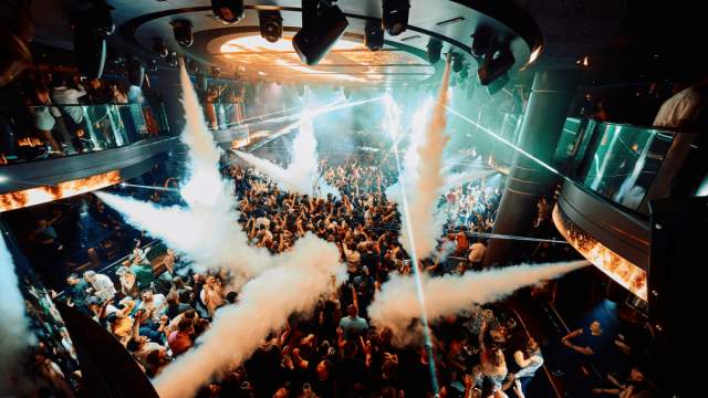 People dancing at LIV nightclub with smoke machines blowing