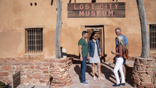 Two couples standing outside of the Lost City Museum in Mesquite.