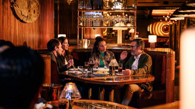 A group of people enjoying a wonder meal at Barry's Downtown Prime in Las Vegas.