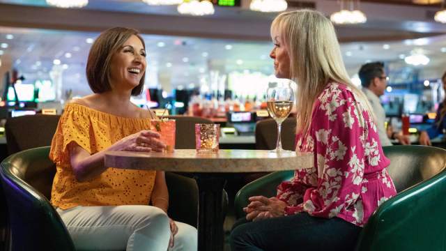 Two women enjoying drinks and a wonderful conversation at Tango's Lounge in Tropicana Laughlin Hotel and Casino in Laughlin, Nevada.