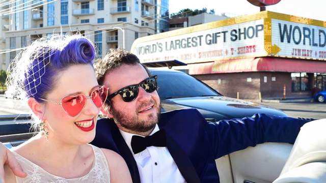 Bride and Groom in a convertible on the Strip