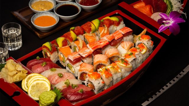 Variety of sushi plated in a boat