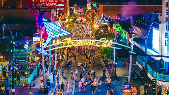 Groups of people walking down Fremont Street in Downtown Las Vegas.