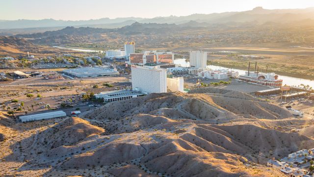 An aerial view of Laughlin with mountains in the background.