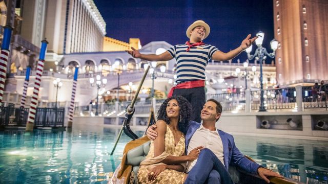A couple enjoys themselves at the Gondola Ride available at The Venetian.