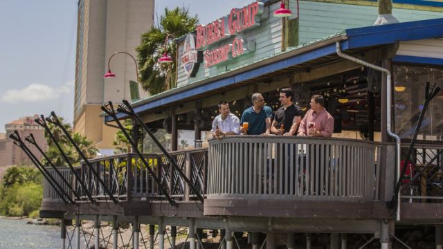 A group of guys enjoying themselves at the famous Bubba Gump Shrimp Co.